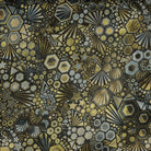 Carmon's Quilt Shop Walnut Phantasma wide fabric features a geometric starburst hexagon design in gold, grey, and silver on a walnut background.