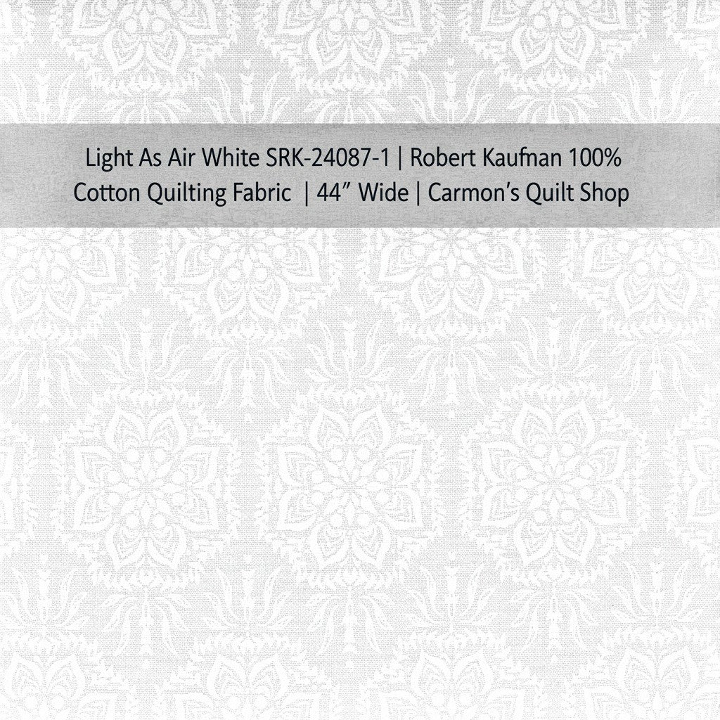 Carmon's Quilt Shop white Robert Kaufman 100% cotton quilting fabric with an elegant airy floral pattern