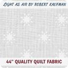 Carmon's Quilt Shop Light As Air white cotton fabric by Robert Kaufman featuring a delicate snowflake pattern.
